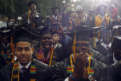 Graduates of the class of 2013 react to their commencement address given by U.S. President Obama during a spring downpour at Morehouse College in Atlanta